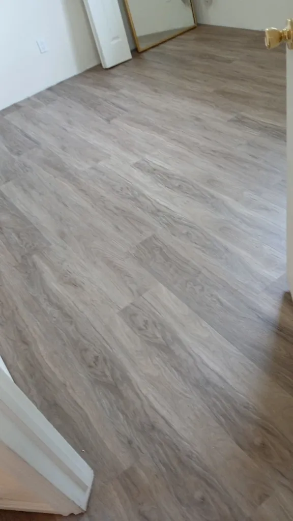 Laminate or engineered wood-look flooring installation by Red Rock Flooring
